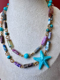Collana Agata a cannetta multicolore con stella marina in grana di turchese