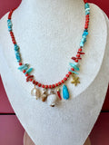 Collana charms conchiglia con corno